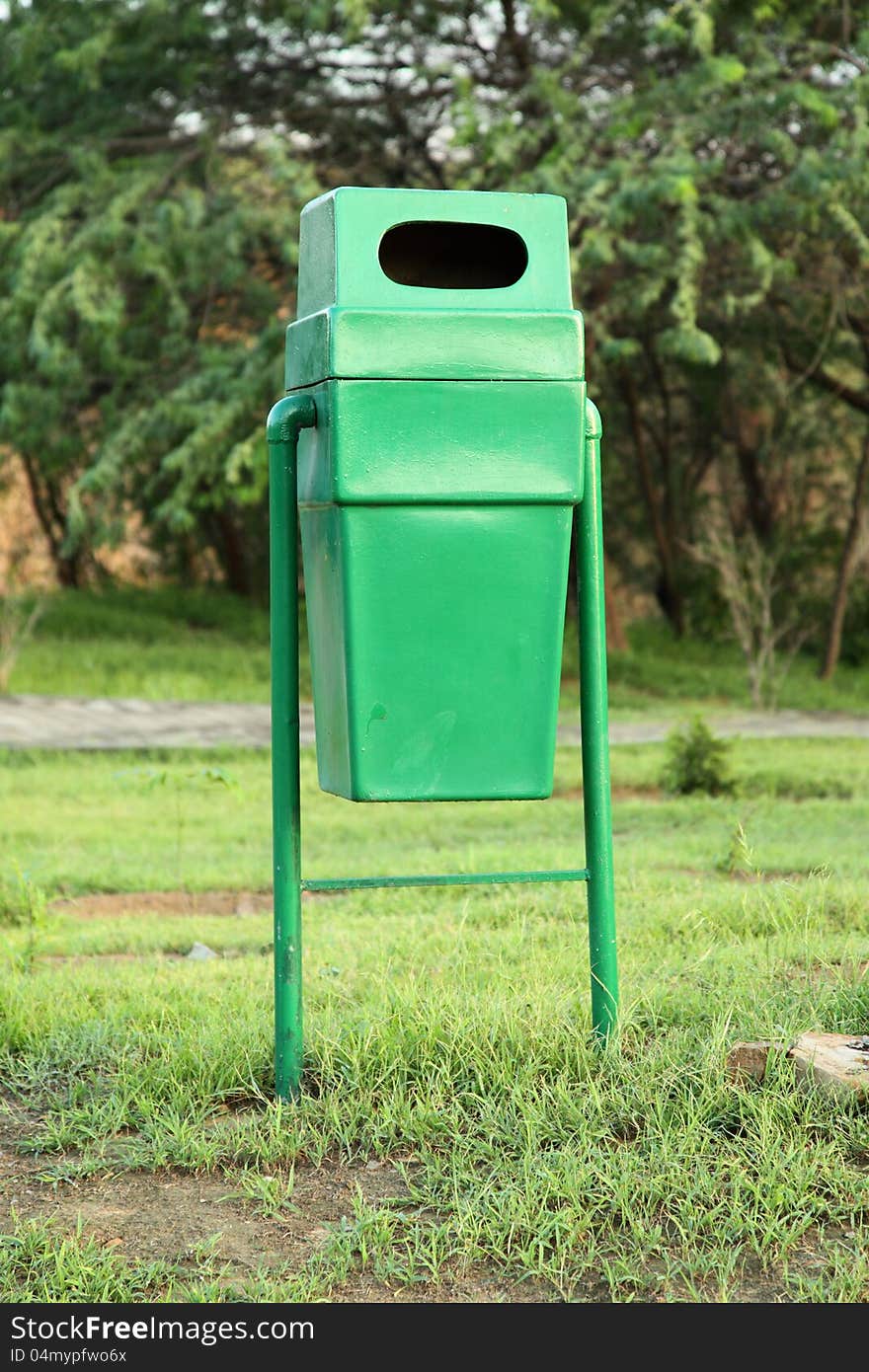 Green single Plastic Dustbin kept in Garden.