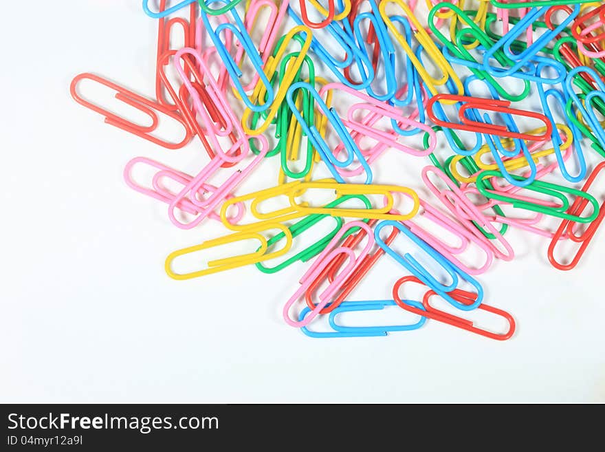 Closed-up paper clips background with empty space