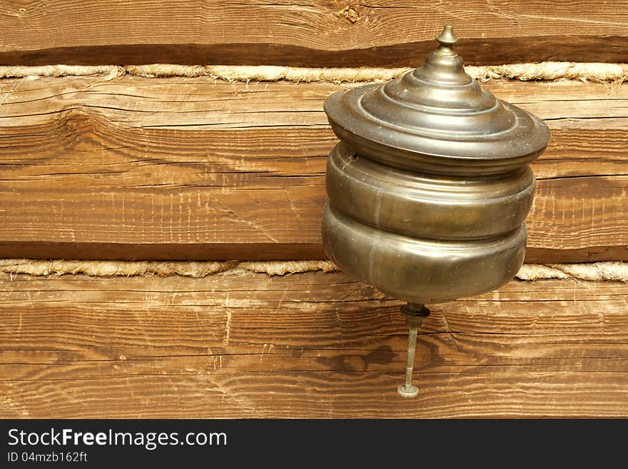 Old metal sink, hanging on the wall of a village house