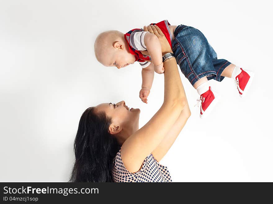 Young women take child on the hands. Young women take child on the hands