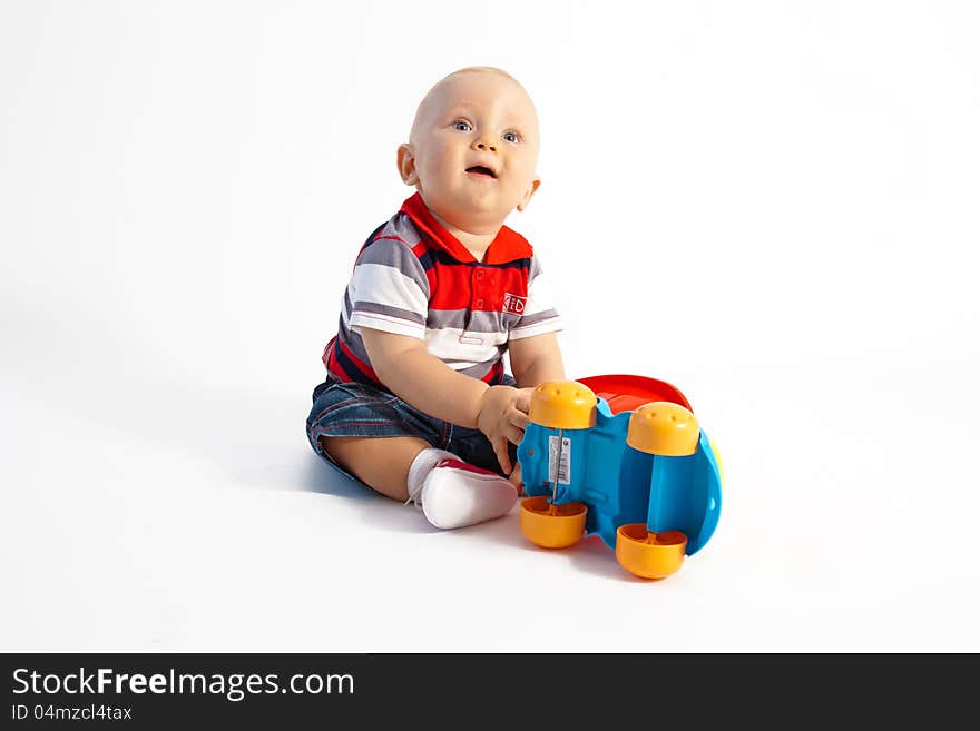 Child sit on the floor with toy. Child sit on the floor with toy