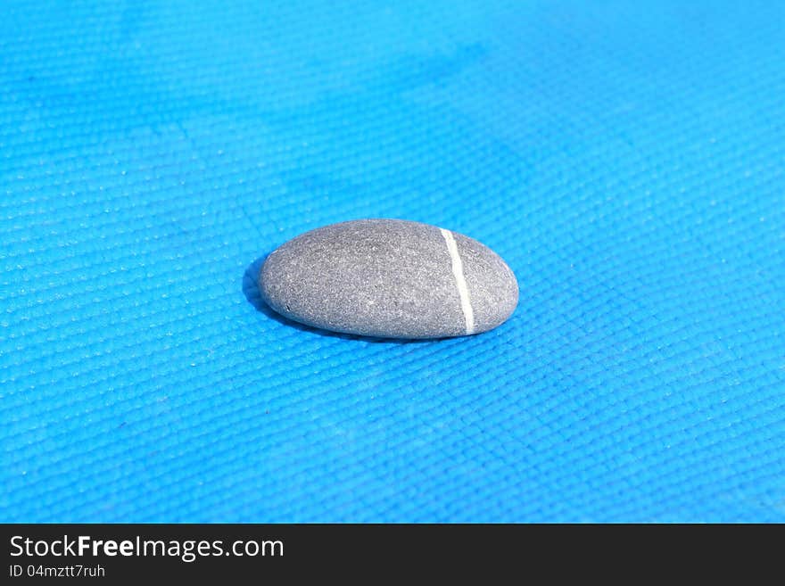 Stone pebbles on a blue background.