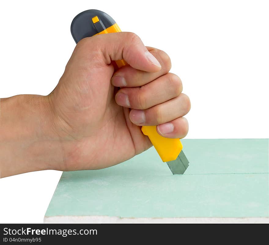 Builder's hand with knife isolated on white background. Include clipping path. Builder's hand with knife isolated on white background. Include clipping path