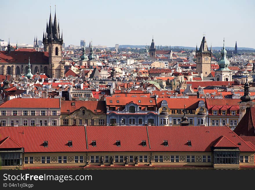 View of red tile roofs and high gothic towers in Prague, Czech Republic. View of red tile roofs and high gothic towers in Prague, Czech Republic