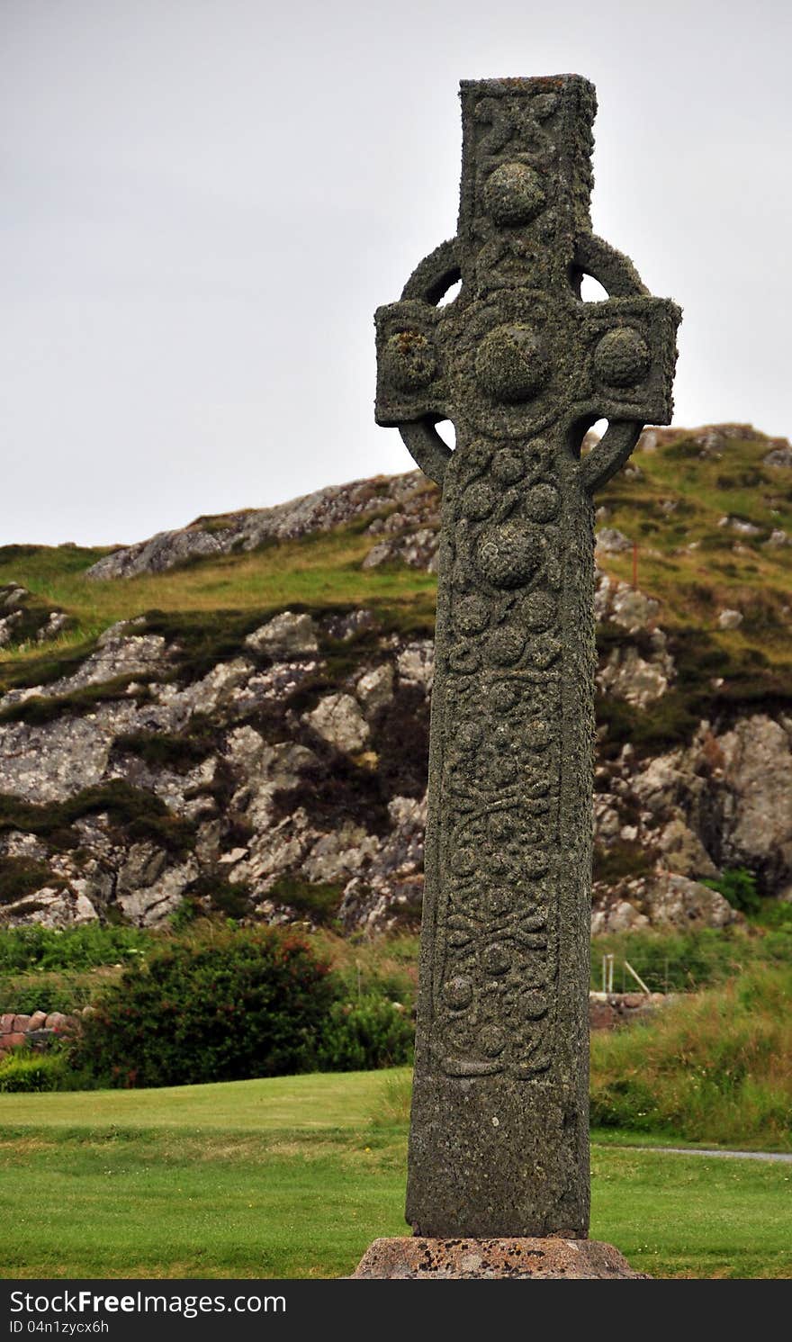 Celtic Cross, Iona Abbey, Argyll and Bute, Iono, Scotland,UK. Iona is a small island in the Inner Hebrides off the western coast of Scotland. It was a centre of Irish monasticism for four centuries and is today renowned for its tranquillity and natural beauty. It is a popular tourist destination and a place for retreats. Its modern Gaelic name means &#x22;Iona of Columba&#x22;. Iona Abbey was a centre of Gaelic monasticism for three centuries and is today known for its relative tranquillity and natural environment. It is a tourist destination and a place for spiritual retreats. Its modern Scottish Gaelic name means &#x22;Iona of &#x28;Saint&#x29; Columba&#x22; &#x28;formerly anglicised&#x22;Icolmkill&#x22;&#x29; Iona Abbey is an abbey located on the island of Iona, just off the Isle of Mull on the West Coast of Scotland. Iona Abbey is the spiritual home of the Iona Community, an ecumenical Christian religious order, whose headquarters are in Glasgow. The Abbey remains a popular site of Christian pilgrimage today.