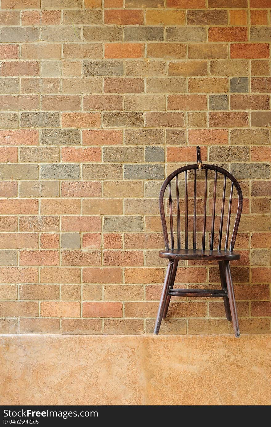 Red brick wall and chair on the wall