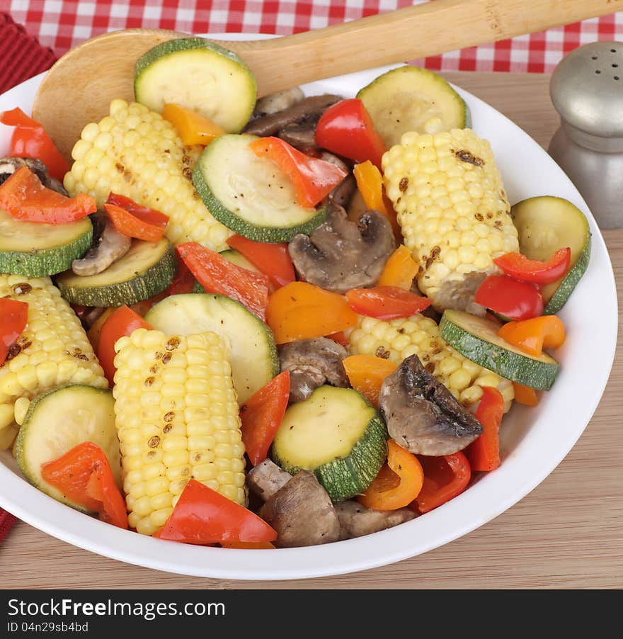 Baked peppers, zucchini, mushrooms and corn in a bowl. Baked peppers, zucchini, mushrooms and corn in a bowl