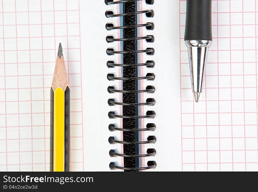 Notebook with pen and pencil, closeup. Notebook with pen and pencil, closeup.