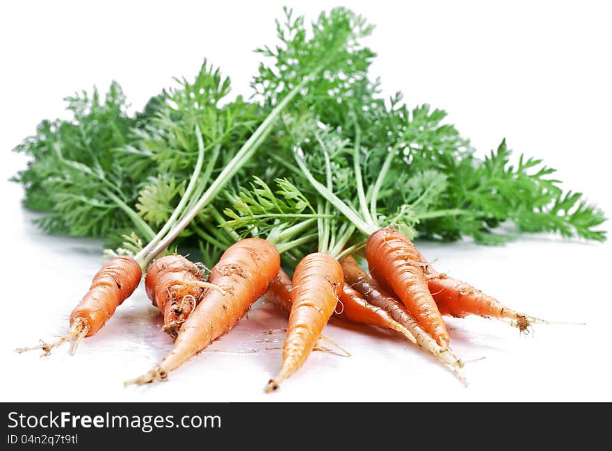 Carrots with leaves on a white background.