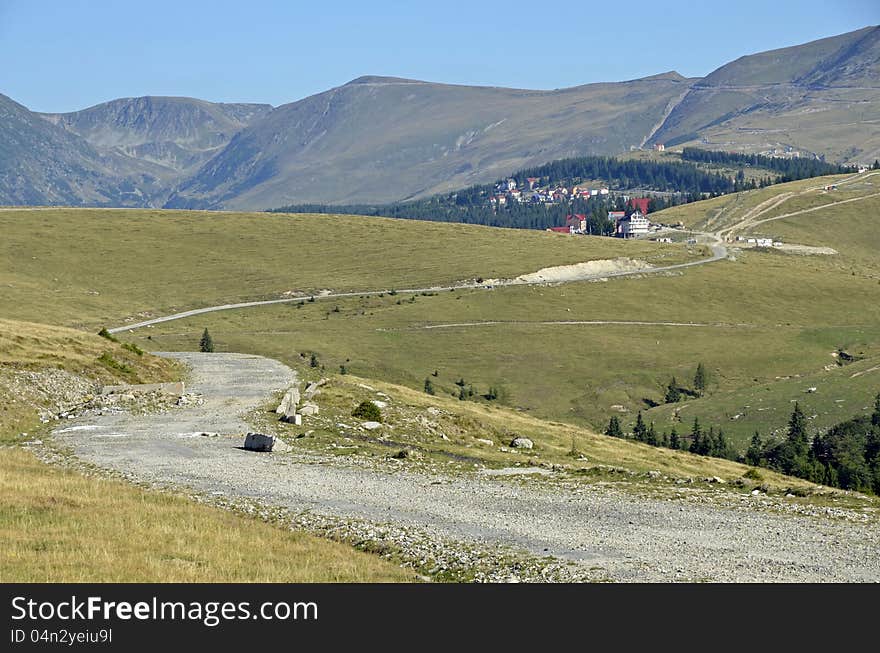 Curved road recently constructed to Padina, Bolboci, Pestera chalets in Bucegi mountains near Bucharest, Sinaia, Ploiesti and Brasov city in Romania. Curved road recently constructed to Padina, Bolboci, Pestera chalets in Bucegi mountains near Bucharest, Sinaia, Ploiesti and Brasov city in Romania