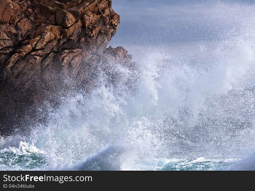 Sea Surf At The Rocky Coast Of Brittany