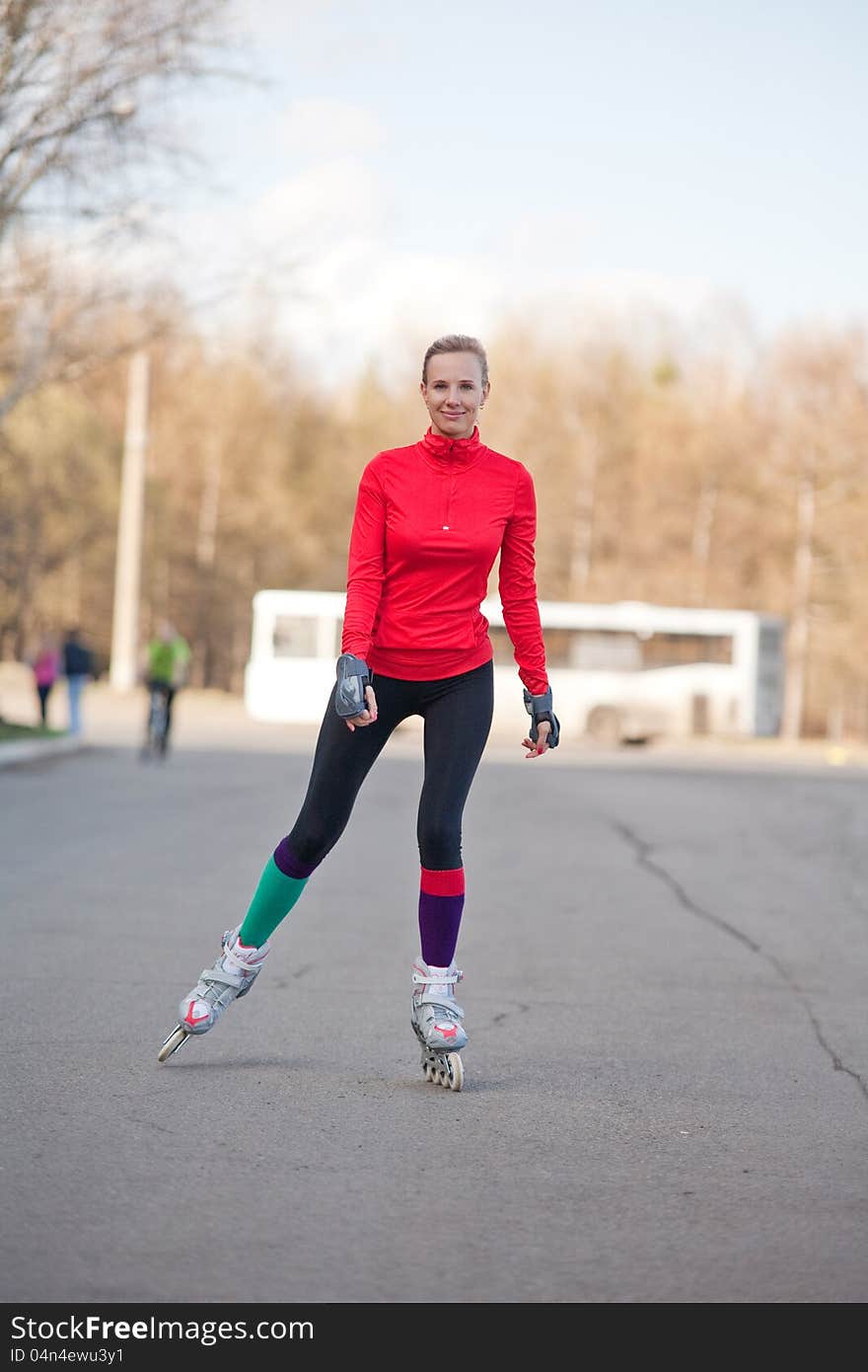 The Girl roller-skating on the road