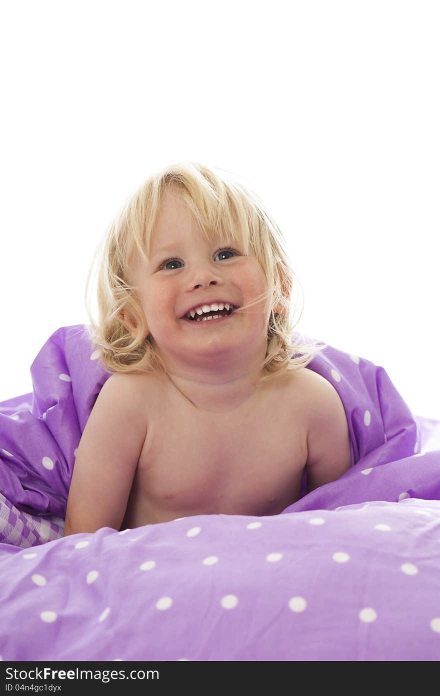 Little boy in bed isolated on white