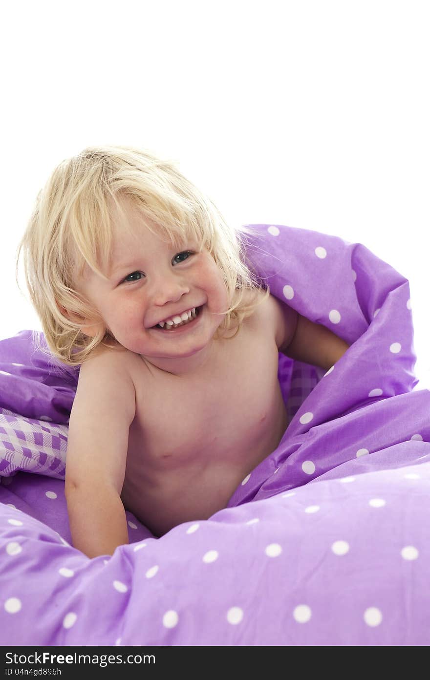 Little boy in bed isolated on white