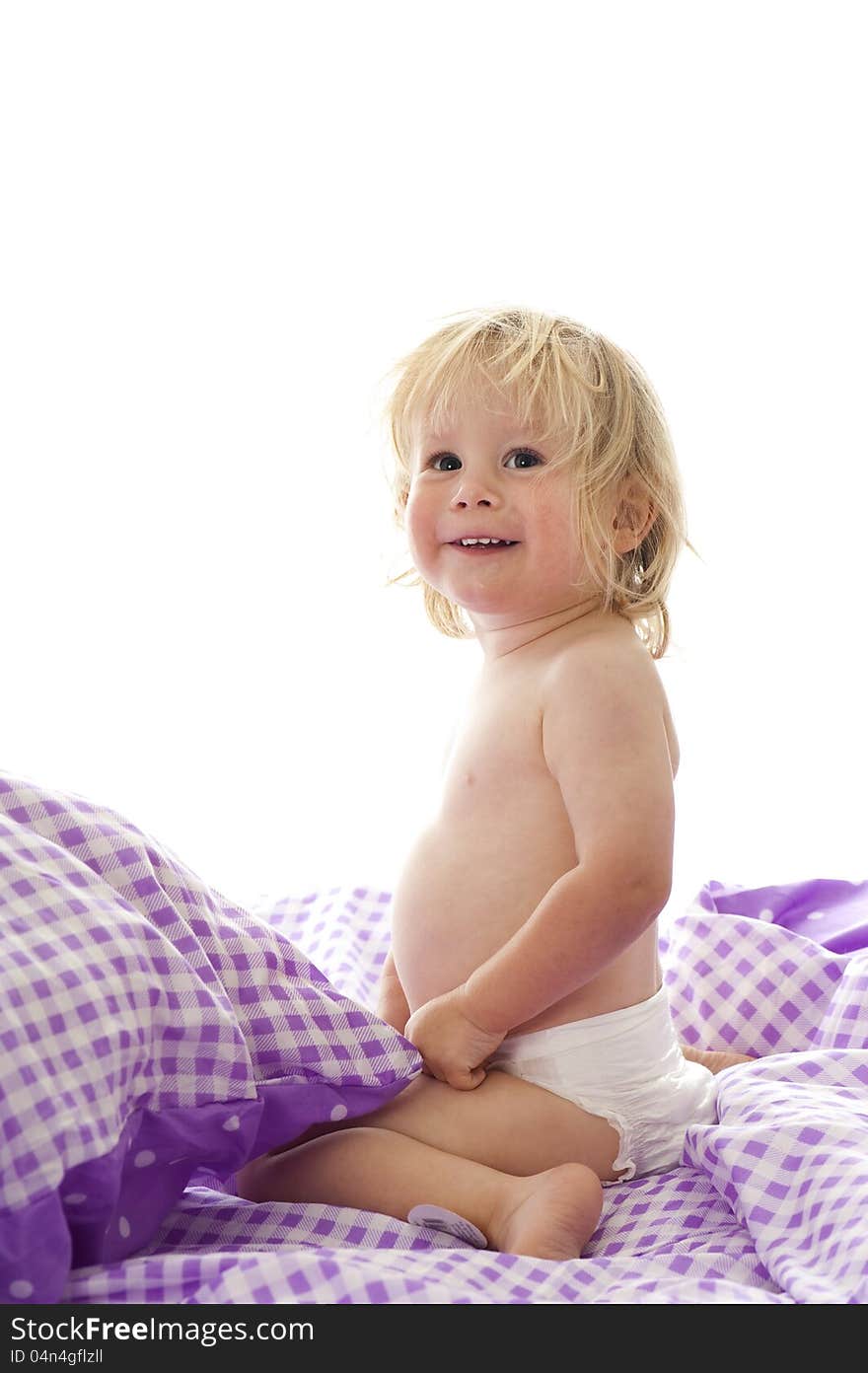 Little boy in bed isolated on white