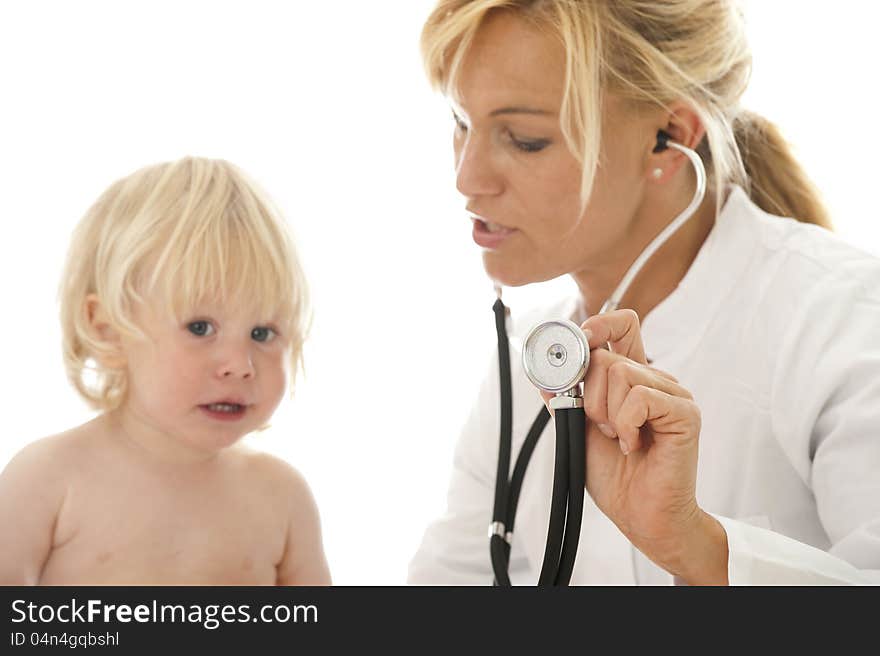 Young female doctor examines a child. Young female doctor examines a child