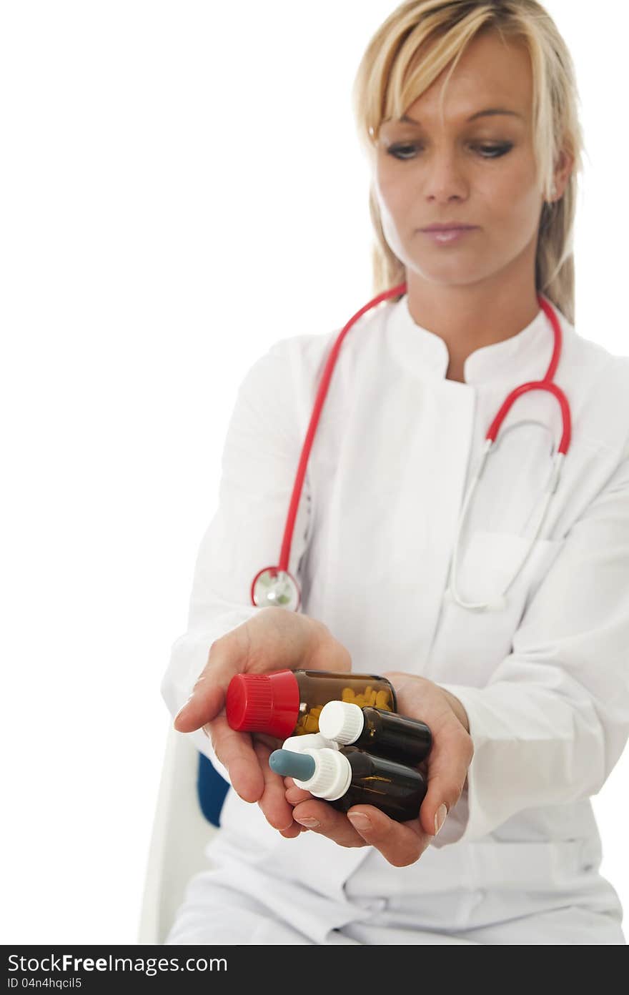 Young female doctor with alternative medicine