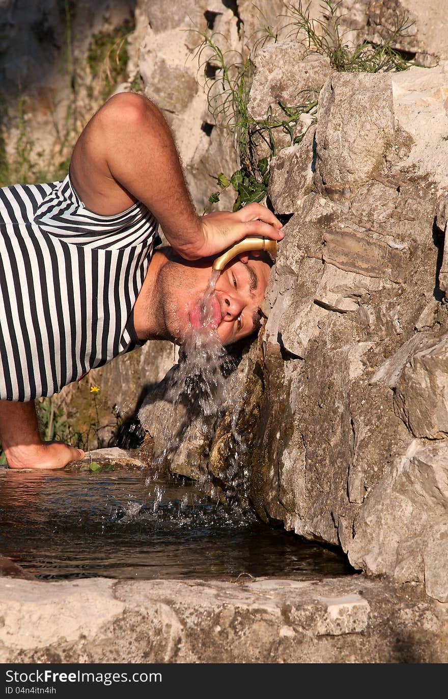 Young man drinking water