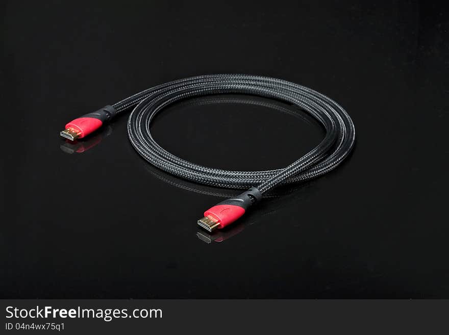 HDMI and Scart cables on black background