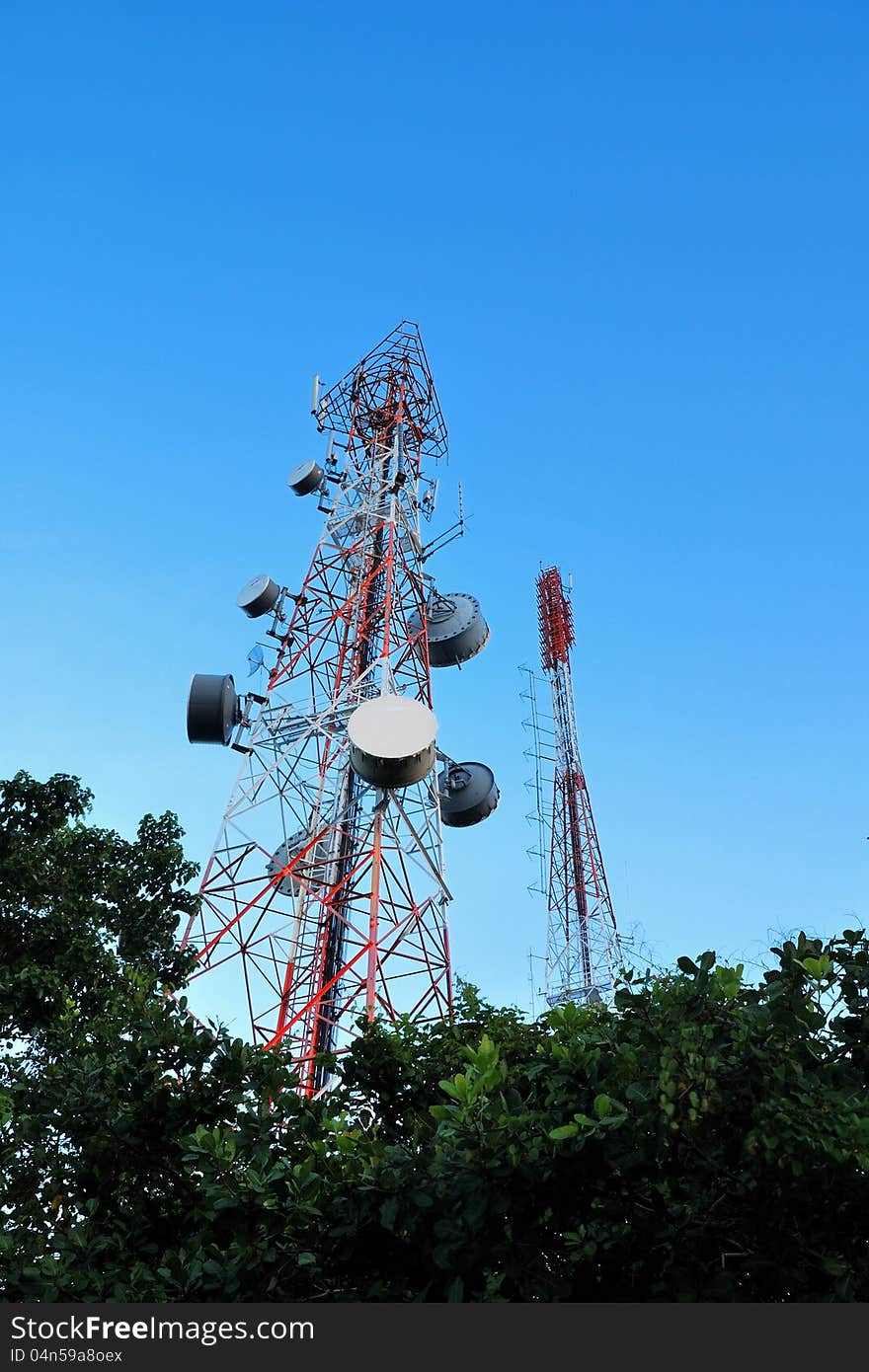 Telecommunication tower with a sunlight. Used to transmit television signals.