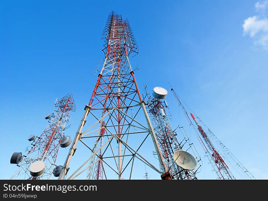 Telecommunication tower with a sunlight. Used to transmit television signals.