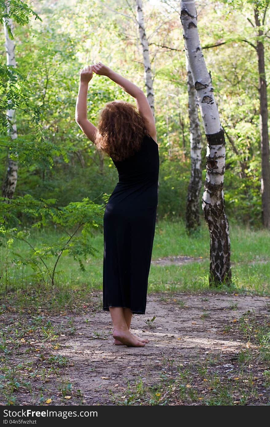 Girl is pulling the birch forest. Girl is pulling the birch forest