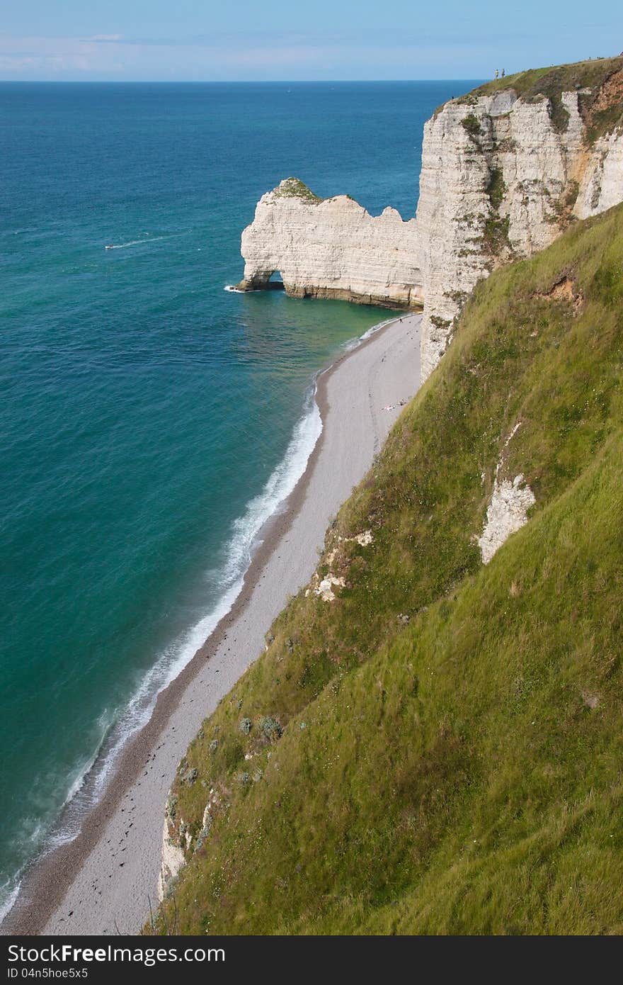 Top view of a cliff in Etretat, France in Normandy with its pebble beach. Top view of a cliff in Etretat, France in Normandy with its pebble beach