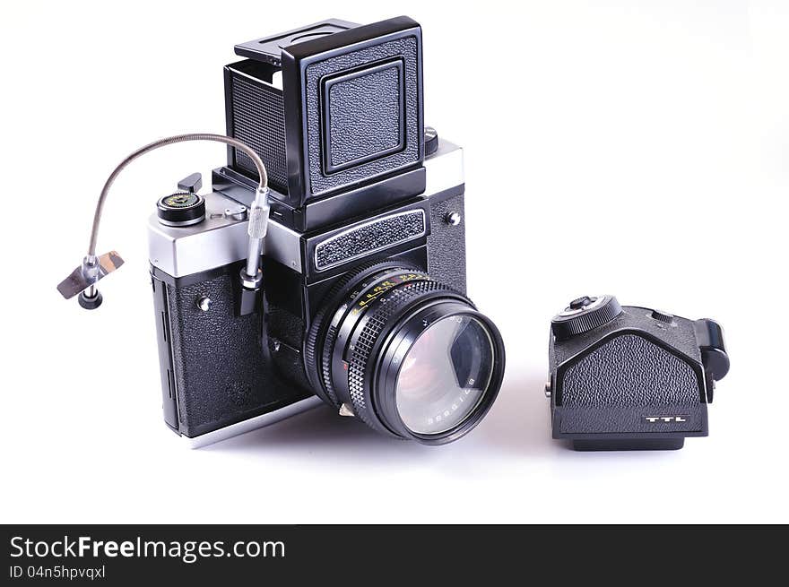 Large format camera with additional TTL prism against a white background. Large format camera with additional TTL prism against a white background