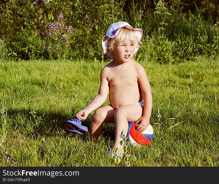 Happy little girl on the green meadow in summer. Happy little girl on the green meadow in summer