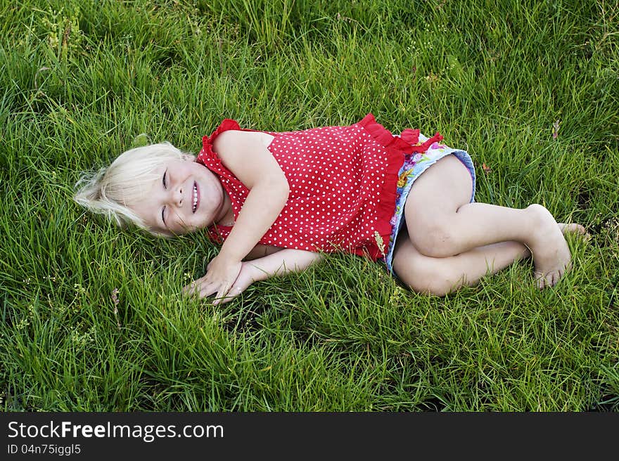 Portrait little girl on the meadow