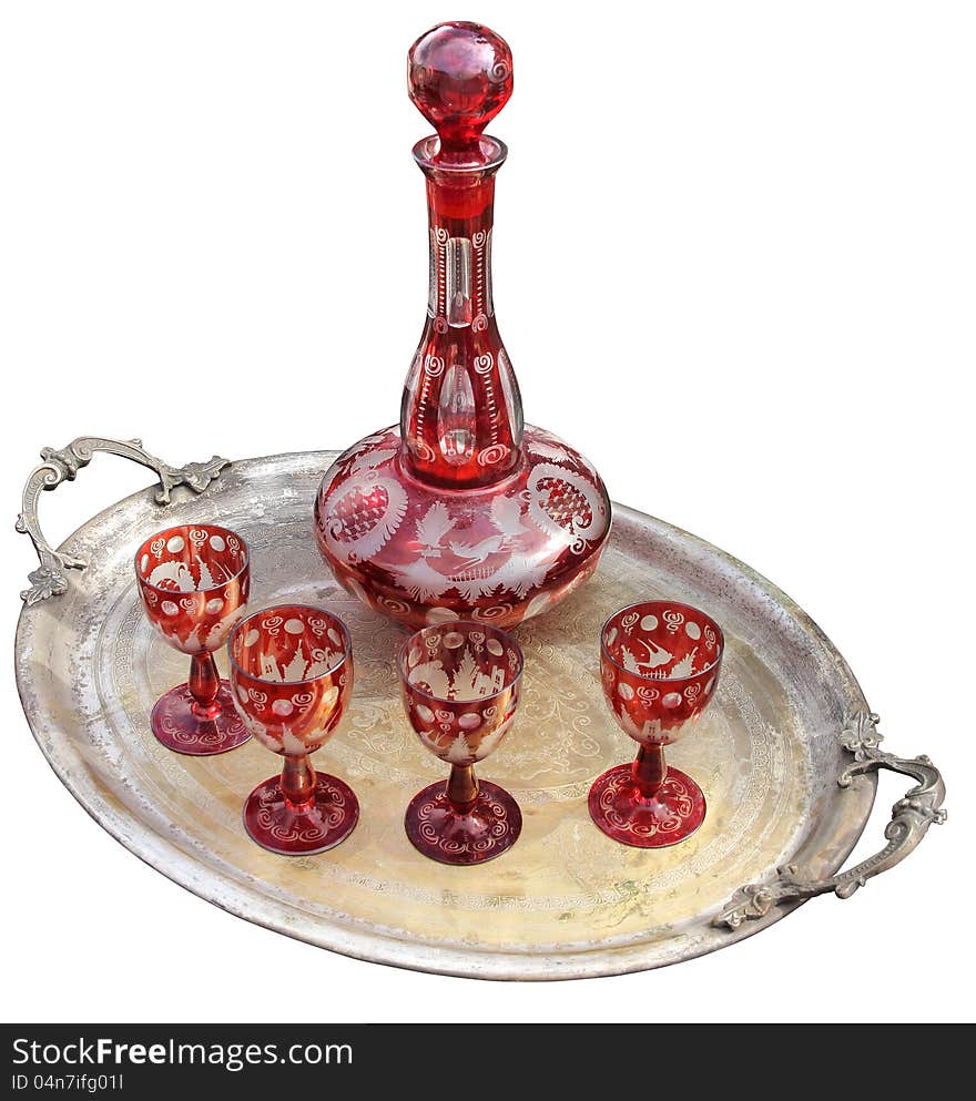 Set of red glasses with bottle on  the silver tray. Set of red glasses with bottle on  the silver tray