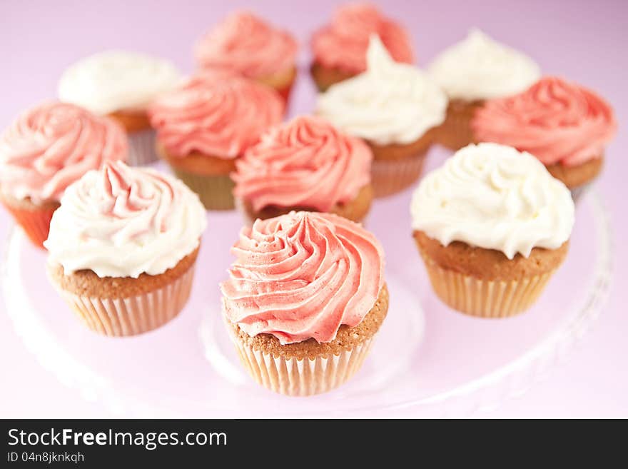 Homemade pink and white cupcakes on the plate