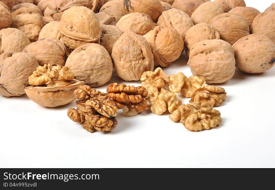 Brown walnuts on white background