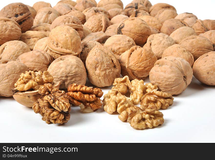 Brown walnuts on white background