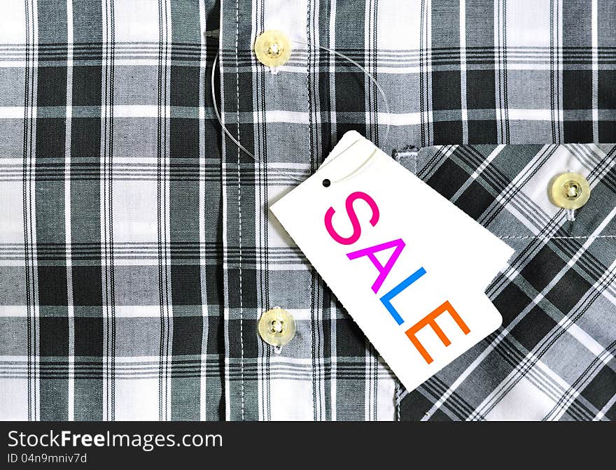 Close up of sale paper pad on shirt. Close up of sale paper pad on shirt