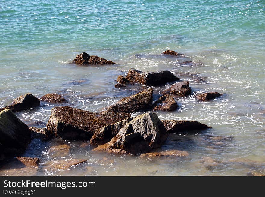 The tidal flow of the Indian Ocean  washes over the rocks near the fishing  groyne at Bunbury south western Australia. The tidal flow of the Indian Ocean  washes over the rocks near the fishing  groyne at Bunbury south western Australia.