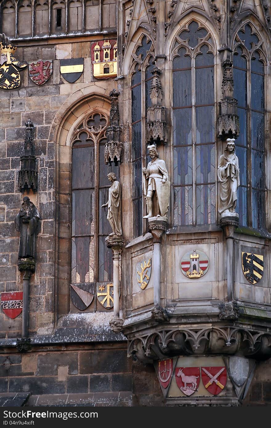 Closeup of Prague Town Hall window with sculptures and arms, Czech Republic. Closeup of Prague Town Hall window with sculptures and arms, Czech Republic