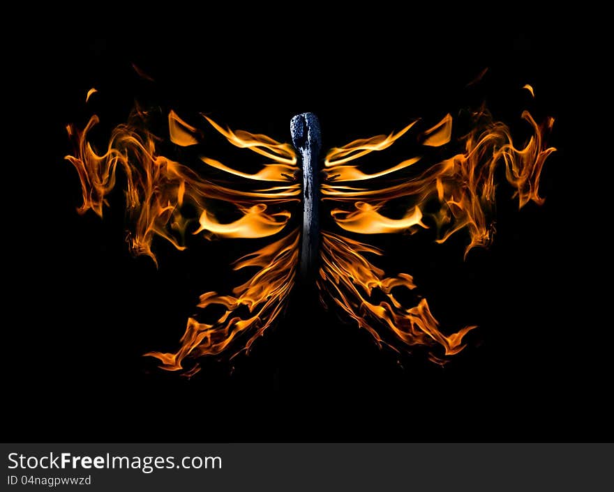 Butterfly shape flame on match isolated on black background