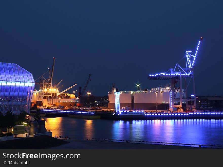 Blue industrial plant at night in port of Hamburg. Blue industrial plant at night in port of Hamburg.