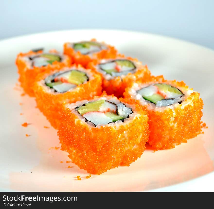 California maki, Japanese traditional food. sticky japanese rice roll with seaweed, sweet eggs cucumber and tobiko