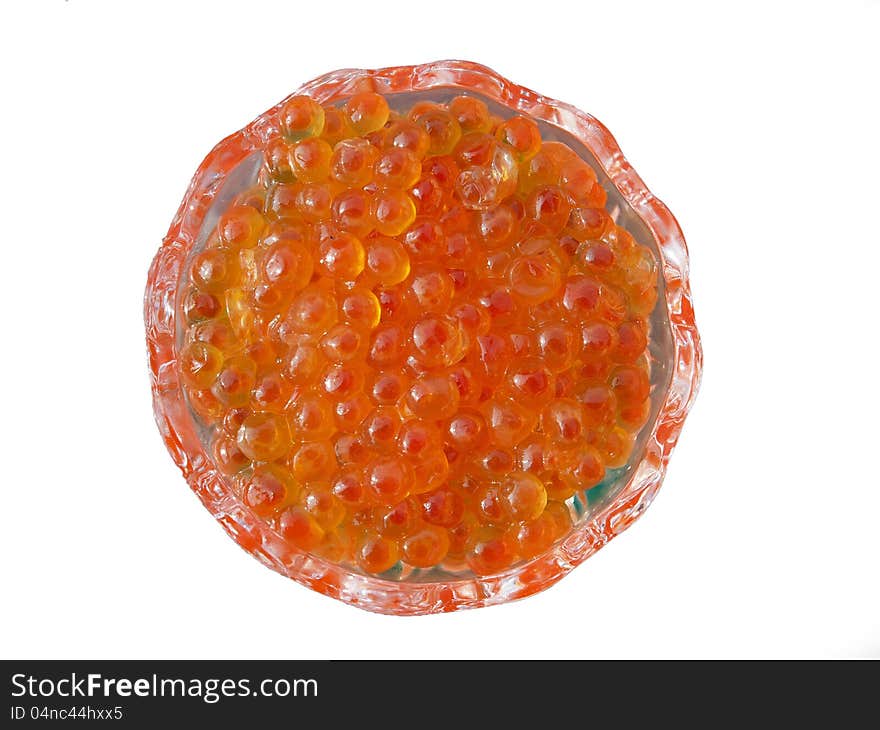 Red caviar in a glass dish close-up, isolated over white. Red caviar in a glass dish close-up, isolated over white