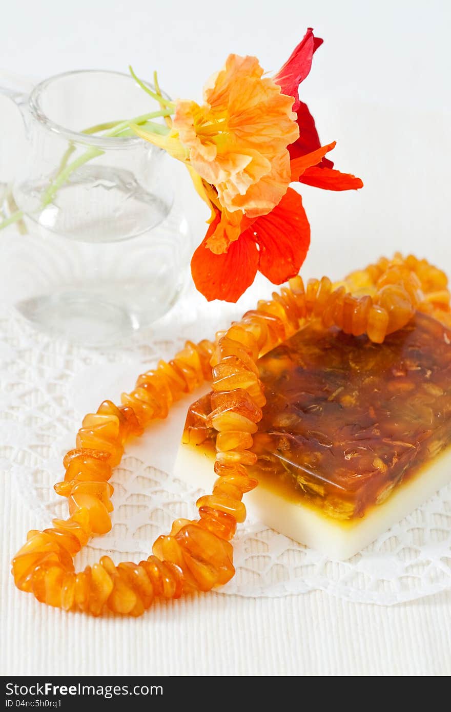 Handmade soap, amber beads and flowers nasturtium