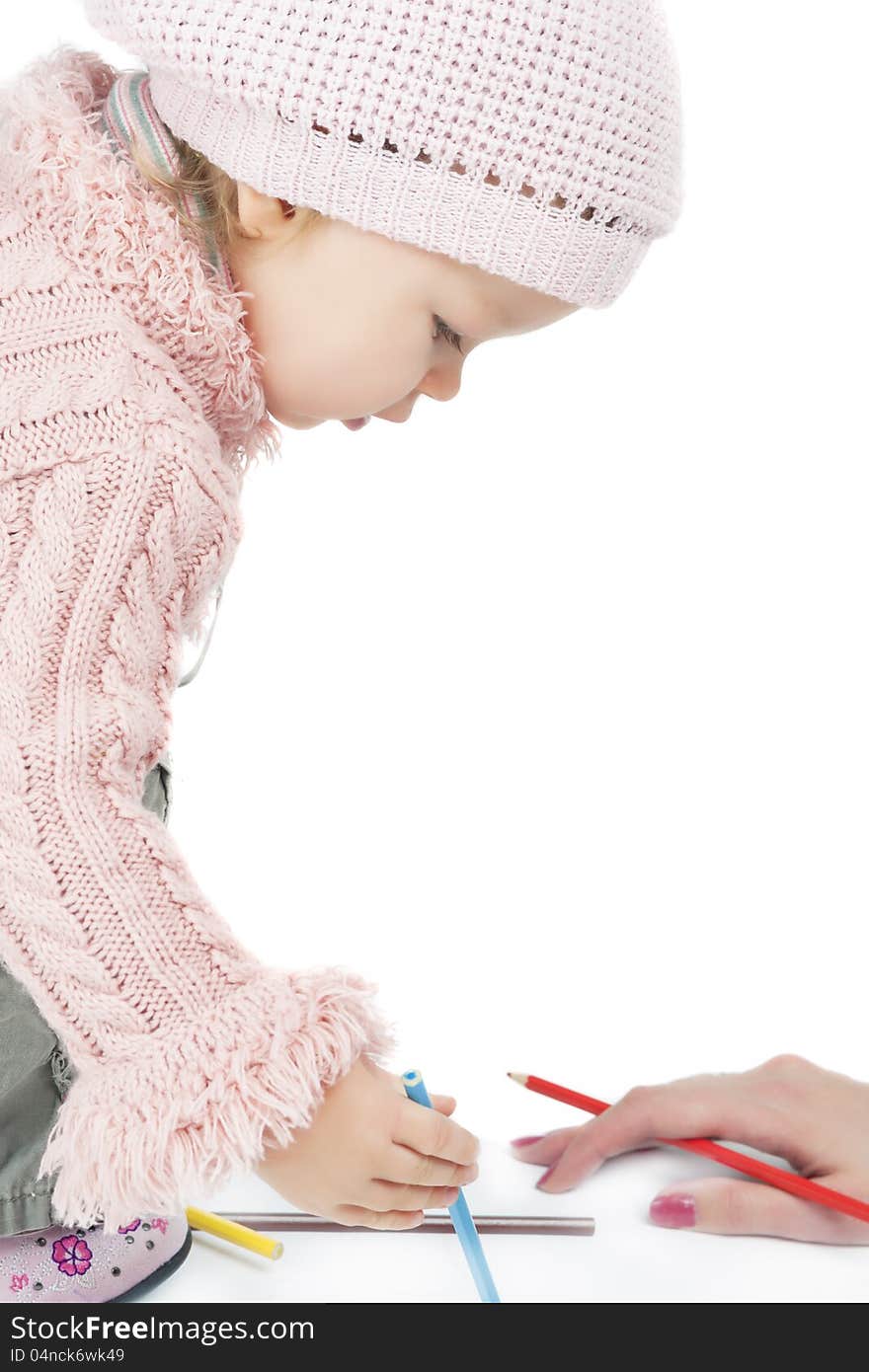 Little cute caucasian girl is tought by mother sitting over white. Little cute caucasian girl is tought by mother sitting over white