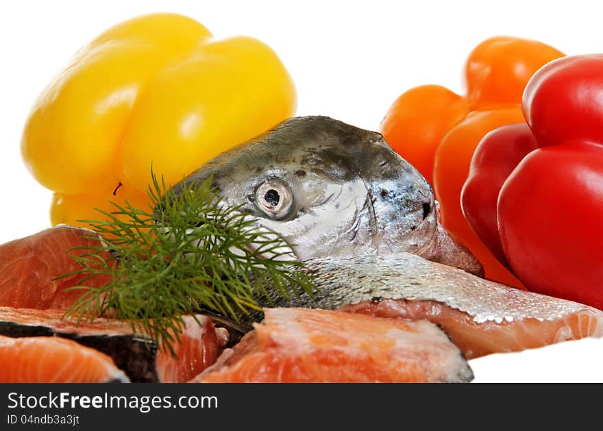 Raw salmon and vegetables on white surface. Raw salmon and vegetables on white surface.