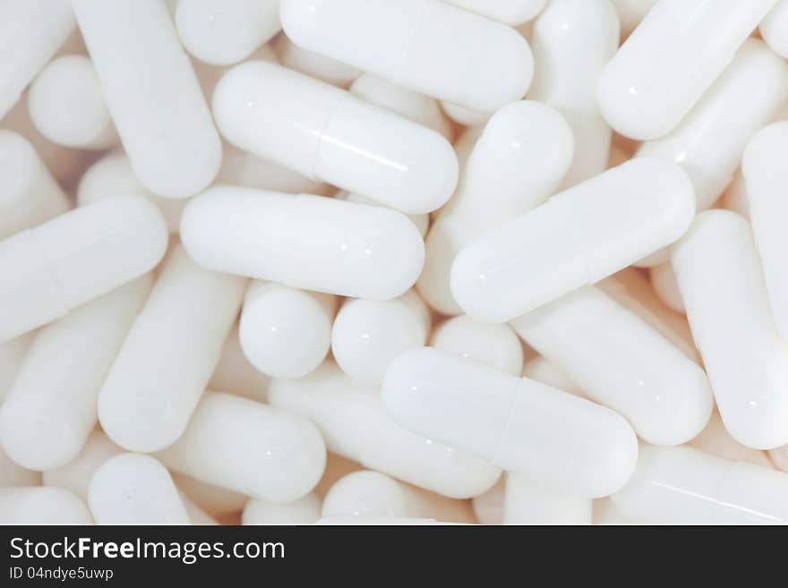 Closed-up white medical capsules for design