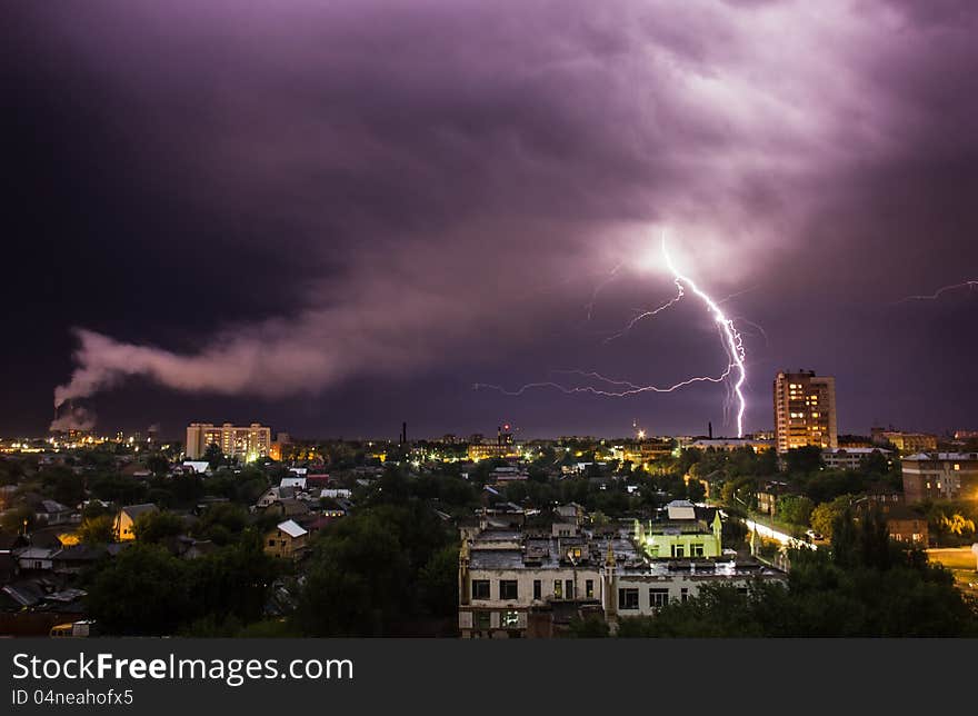 Lightning during a thunderstorm in the night city. Lightning during a thunderstorm in the night city