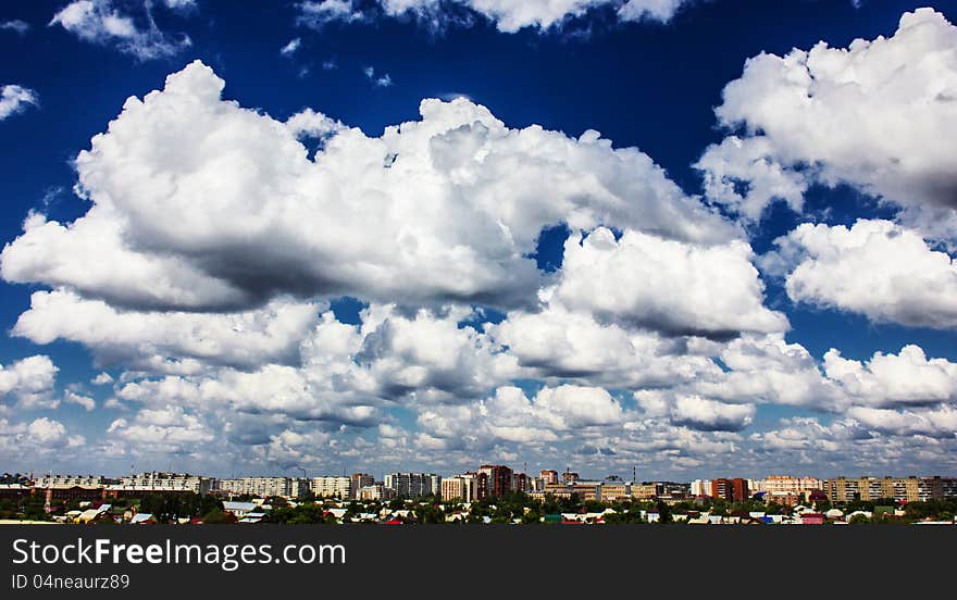 View of the city and the sky from the window. View of the city and the sky from the window