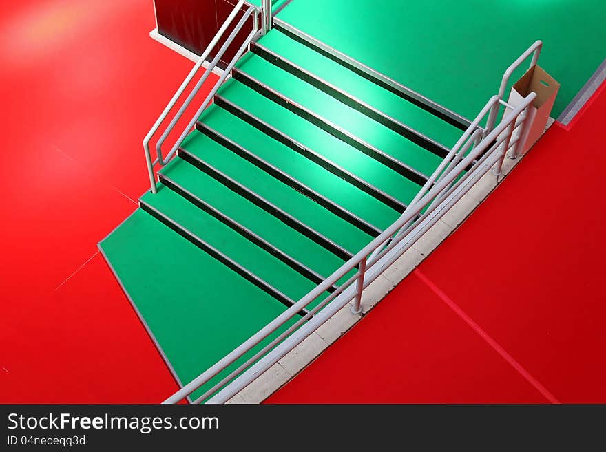 Green stairway and red carpet from above