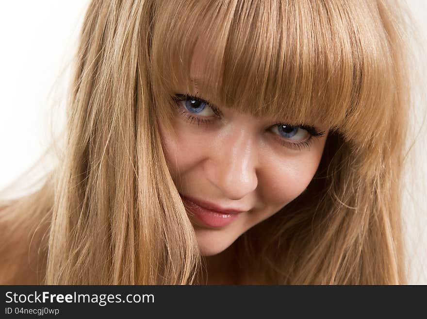 Face of the girl with blue eyes close up