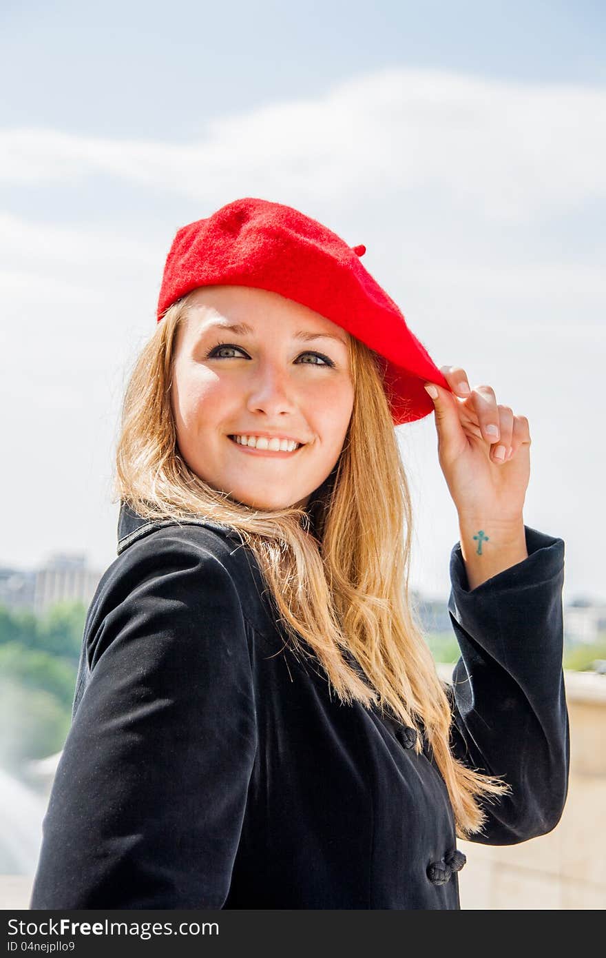 A Beautiful girl, wearing a red hat and smiling. A Beautiful girl, wearing a red hat and smiling.